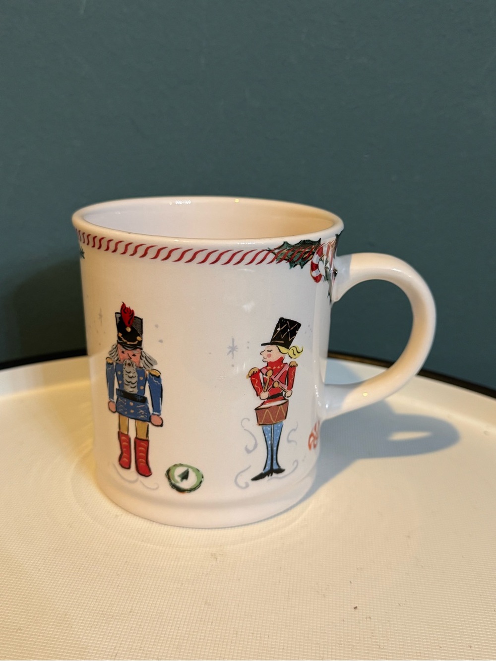 Sur La Table White Ceramic Nutcracker Holiday Mug with Red and Blue Accents